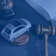 Toy Luxury Car Next To Judge Gavel And Law Book